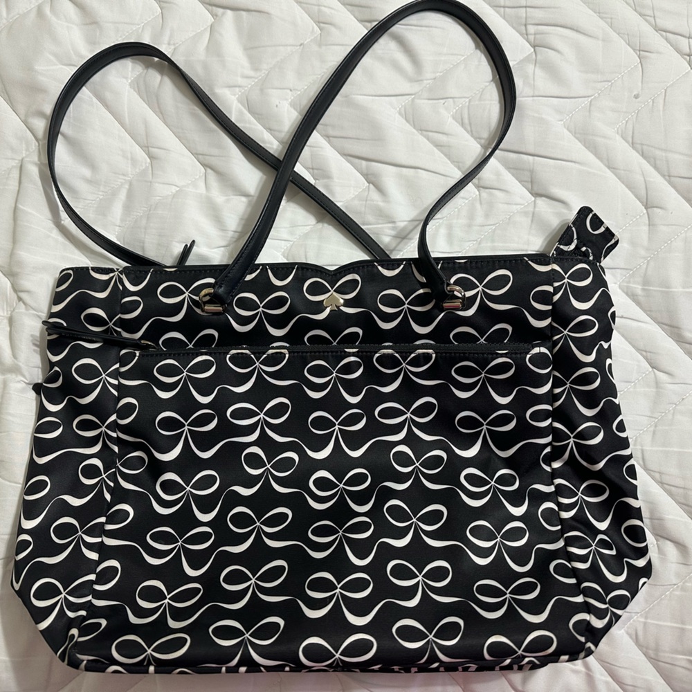 Kate Spade black nylon tote with white bow design.